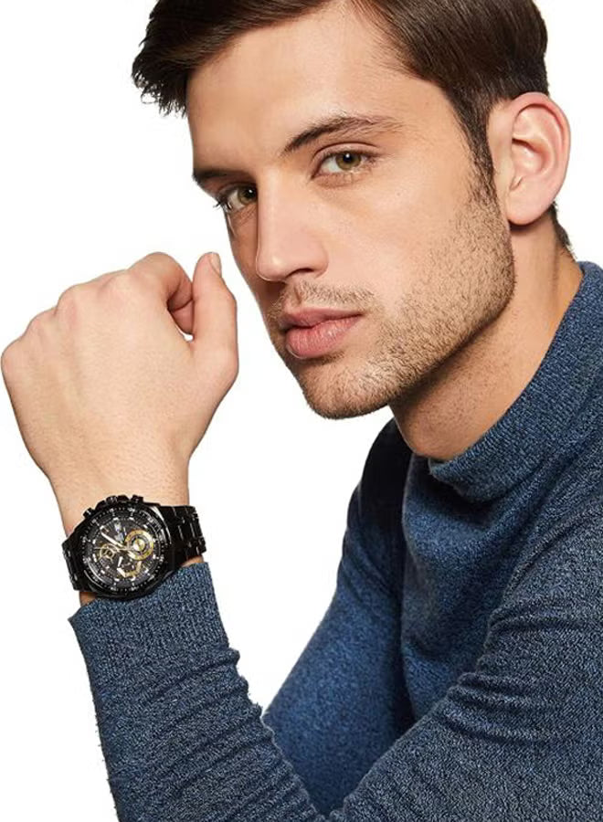 Man wearing a black wristwatch with a white background