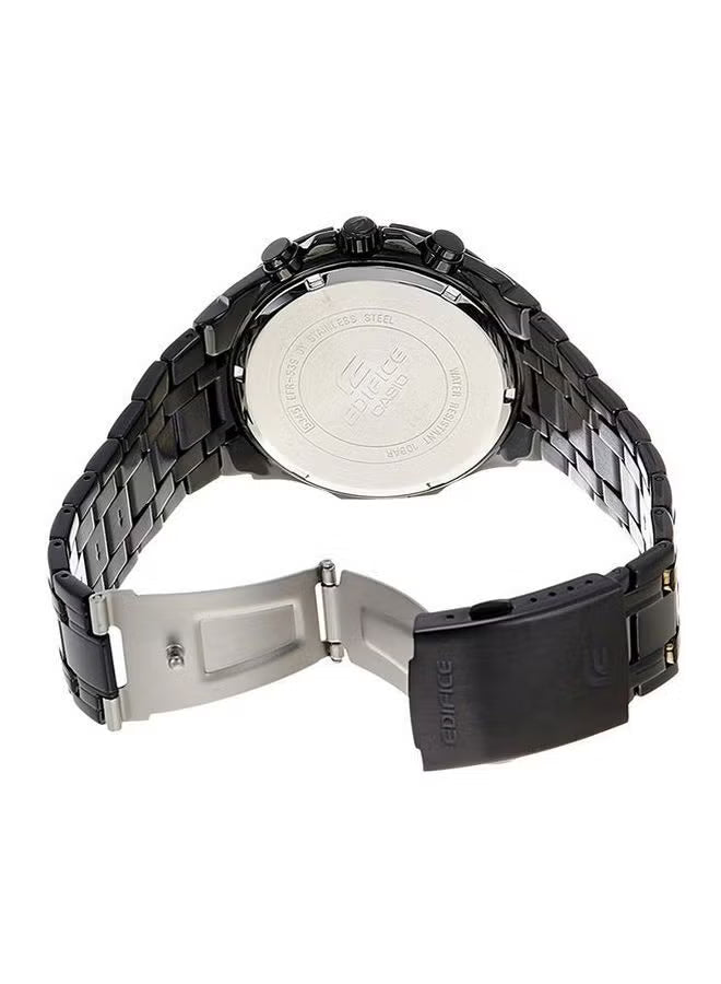 Back view of a black watch with metal band on a white background