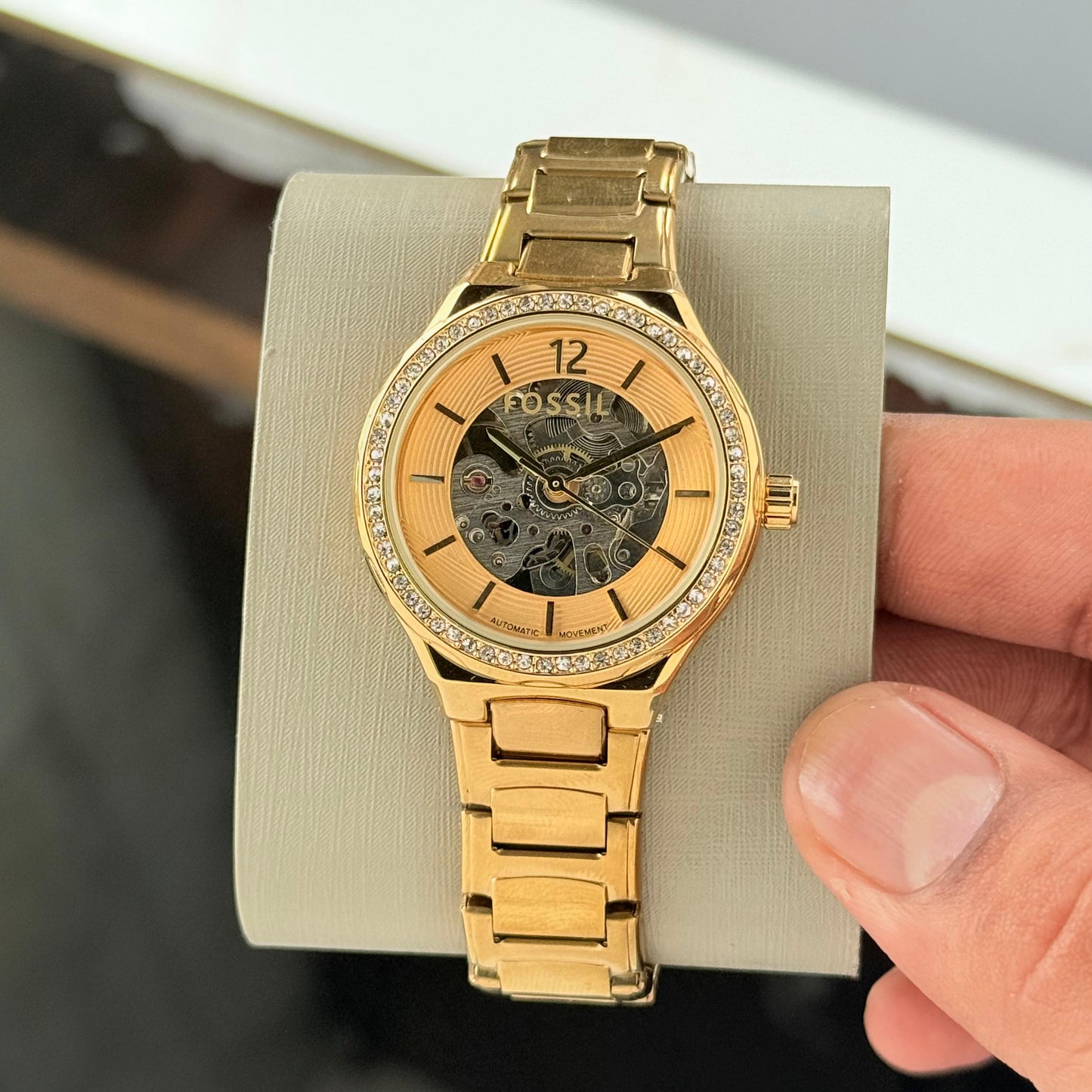 stylish fossil women’s watch with gold stainless steel dial and silver strap